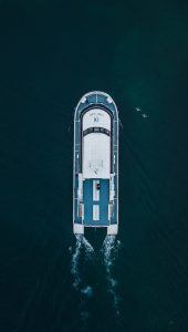 aerial-photo-of-yacht-on-body-of-water-during-dayt by .