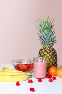 strawberry-juice-beside-fruits-on-top-of-table by .